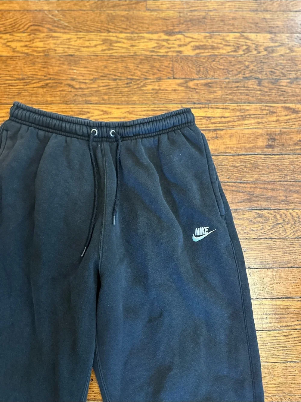 Nike black sweatpants with white logo,